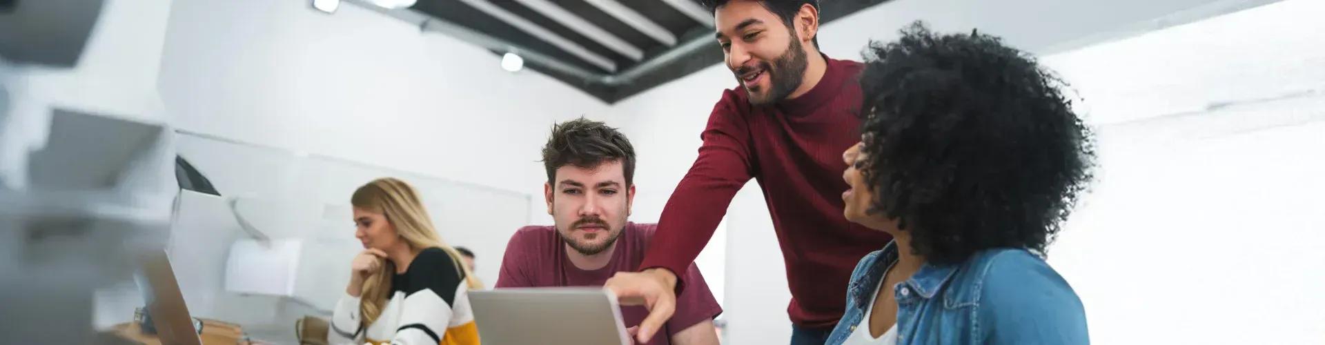Colleagues working together at a laptop